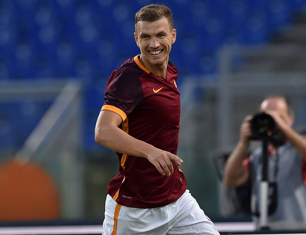 ROME, ITALY - AUGUST 14: Edin Dzeko of AS Roma celebrates after scoring the opening goal during the pre-season friendly match between AS Roma and Sevilla FC at Olimpico Stadium on August 14, 2015 in Rome, Italy. (Photo by Giuseppe Bellini/Getty Images)