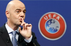 UEFA General Secretary Gianni Infantino asks the audience for silence before the draw for the play-off matches for UEFA Euro 2016 at the UEFA headquarters in Nyon, Switzerland, October 18, 2015. The draw will define the four pairings as well as the order of the home-and-away ties. The first legs will be played between 12 and 14 November and the return legs between 15 and 17 November in line with the Week of Football match pattern. REUTERS/Denis Balibouse TPX IMAGES OF THE DAY